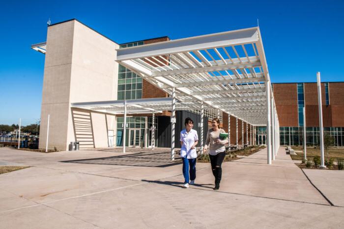 Students departing nursing and health sciences building.